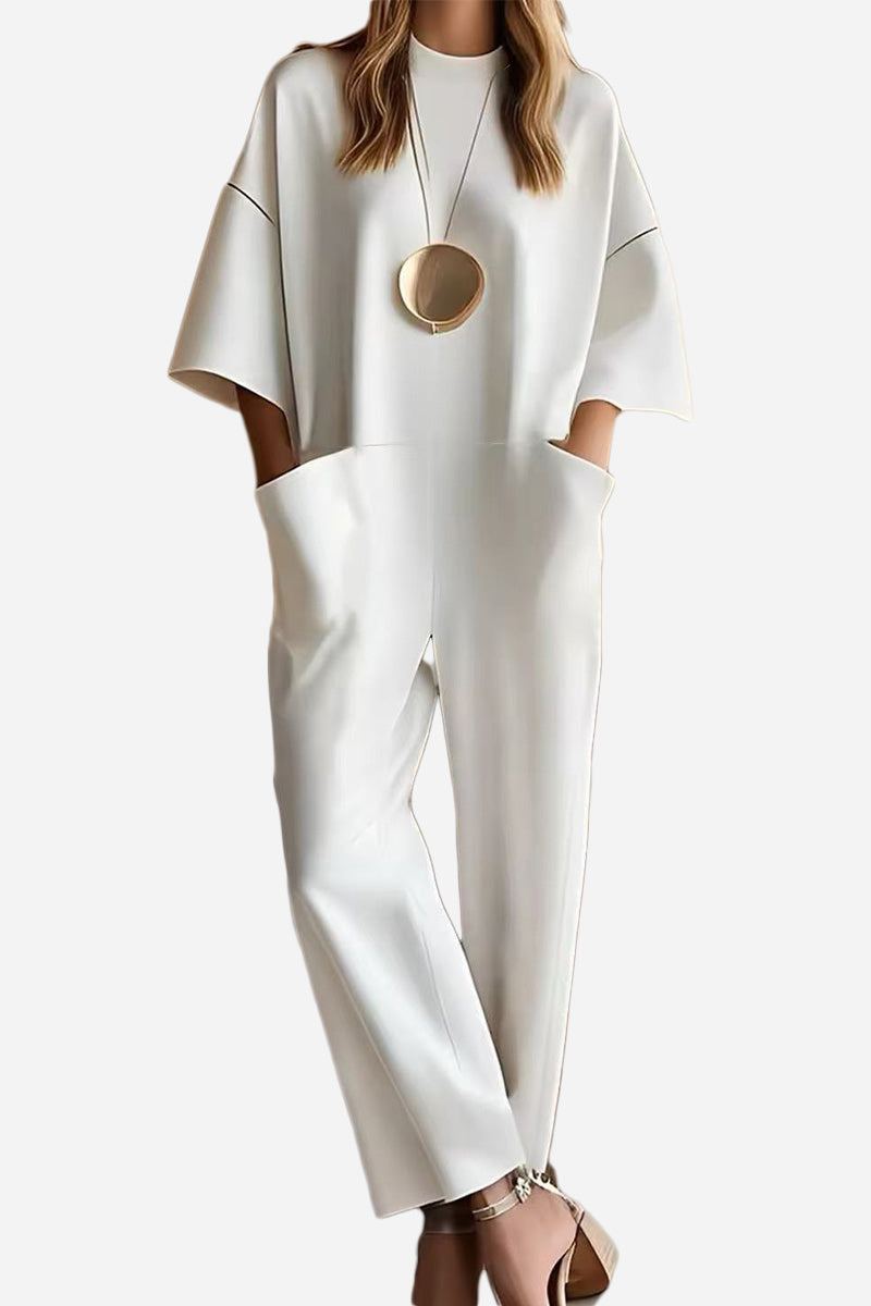 Serene Minimalist Pocket Jumpsuit in white with loose fit and deep side pockets