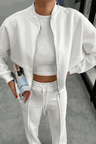 The Voyager Zip Set white zip-front sweatshirt and wide-leg joggers travel outfit