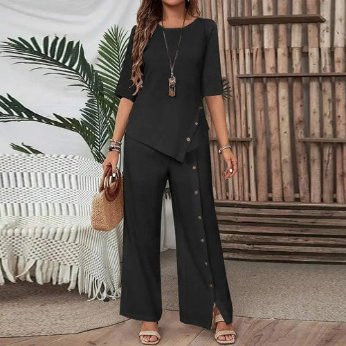 Black Asymmetry Flow Co-ord with button-front top and flowing pants, featuring irregular hem and relaxed silhouette for comfortable stylish wear