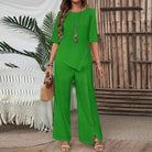 Green Asymmetry Flow Co-ord set with button-front top and loose wide-leg pants, featuring asymmetrical hem and flowing fabric for casual elegance