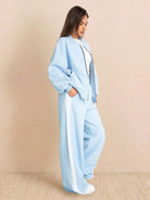 Woman wearing soft cotton-blend two-piece Easy Airport Lounge Set with zip-front jacket and wide-leg pants