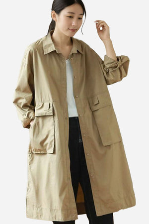 Nomad Ease Oversized Shirt-Jacket beige long lightweight coat with roll-up sleeves and large front pockets model wearing size L-XL