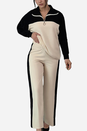 Woman wearing Colorblock Comfort Leisure Set with half-zip stand collar top and wide-leg pants in beige and black colorblock design.