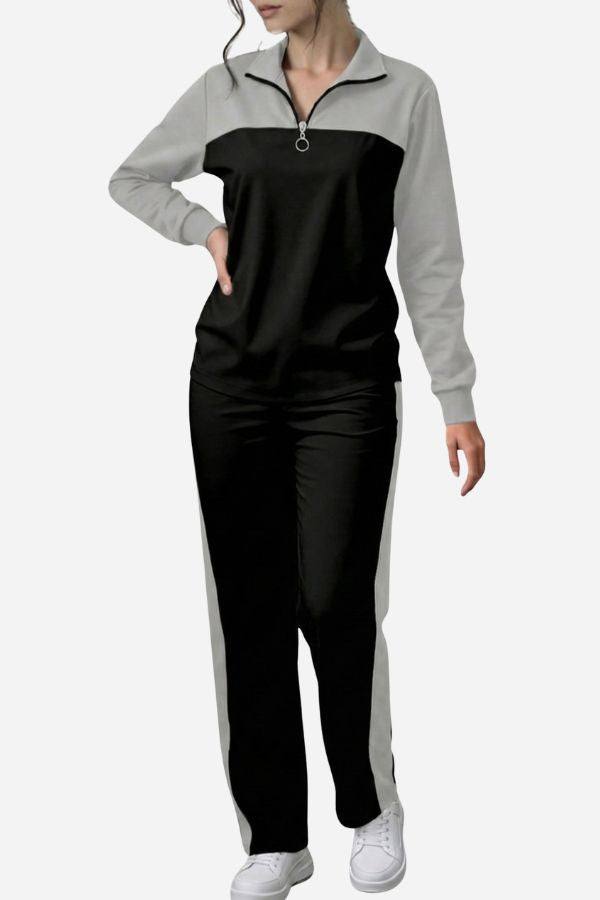 Woman wearing Colorblock Comfort Leisure Set with half-zip, stand collar, black and grey color-block design, and wide-leg pants.