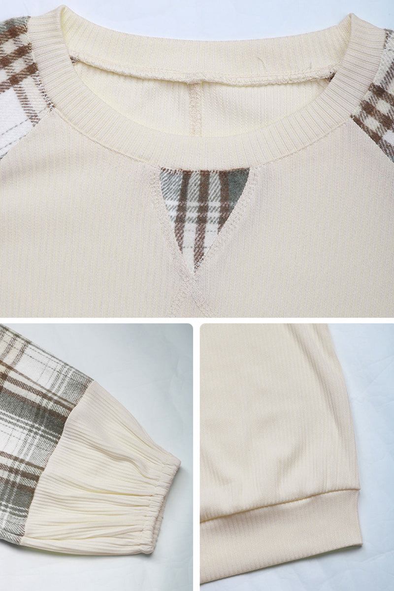 Cream waffle knit sweatshirt with plaid sleeves and v-notch neckline detail close-up shots