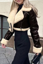 Cropped faux leather sherpa jacket with cream trim and full fleece lining for warmth and style