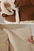 Cropped faux leather jacket with soft cream sherpa lining and trim, warm and wind-resistant design.