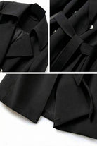 Black Timeless Retro Belted Trench Coat with wide lapels, adjustable waist belt, and full-length cut in smooth structured fabric