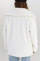 Back view of white open front oversized faux fur jacket with draped collar and relaxed fit