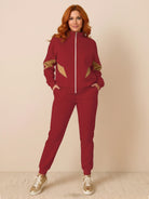 Colorblock Comfort Tracksuit with contrast curved panels, stand collar jacket, and relaxed straight-leg pants in wrinkle-resistant polyester fabric.