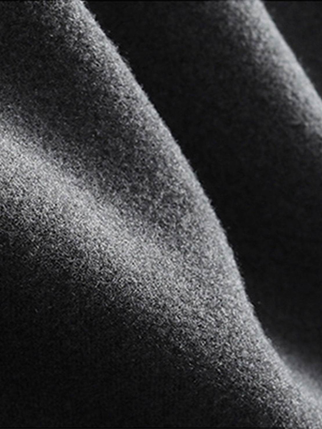 Close-up of soft dark grey lyocell-blend fleece fabric for hooded set