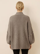 oversized button-front knit cardigan with balloon sleeves and gold-tone buttons