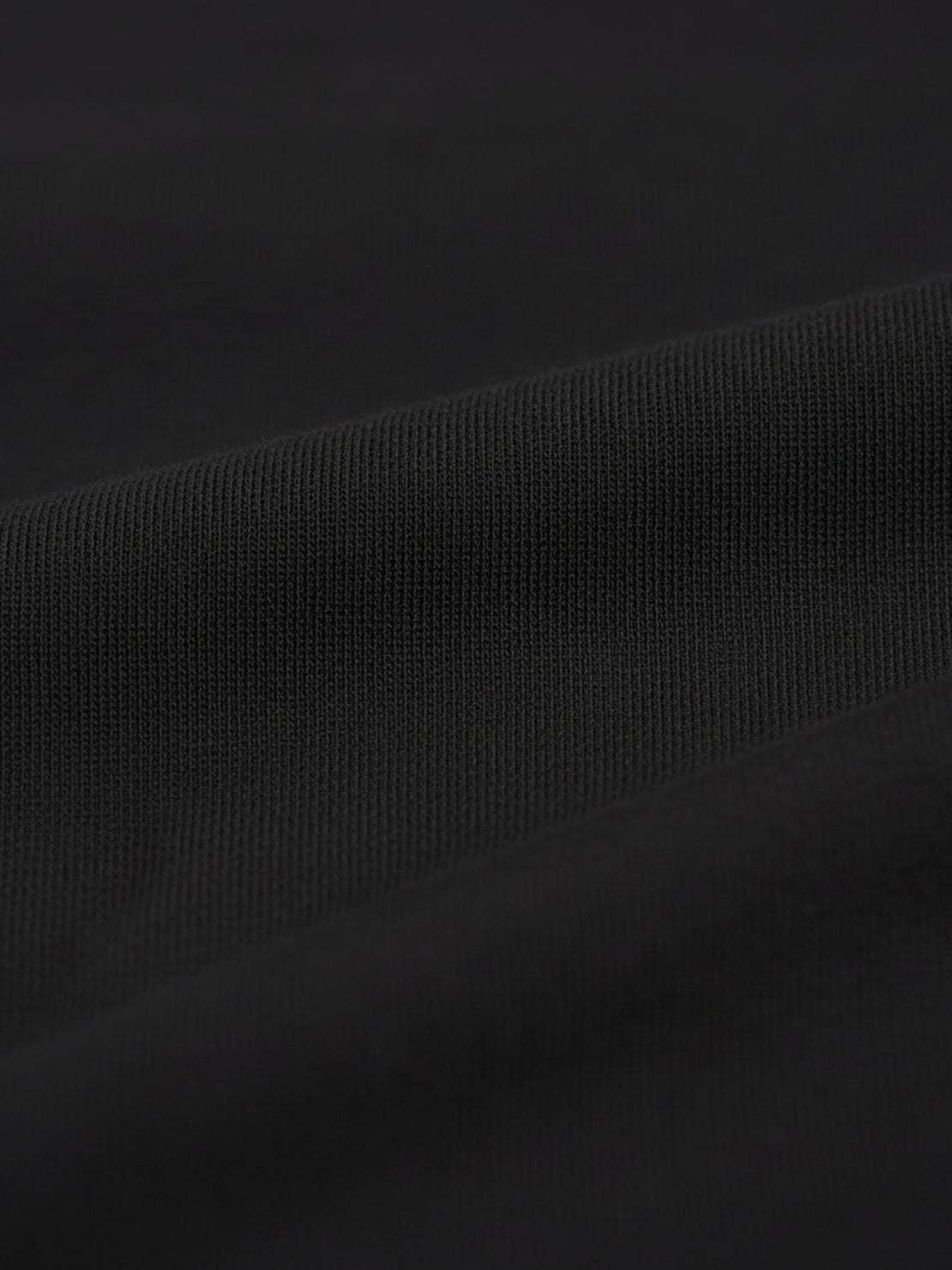 Wrinkle-free polo set with quarter-button top and high-waisted pants in breathable structured fabric