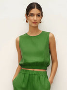 Lightweight linen-blend sleeveless top and wide-leg pants set with elastic waistband and side slits for breathability