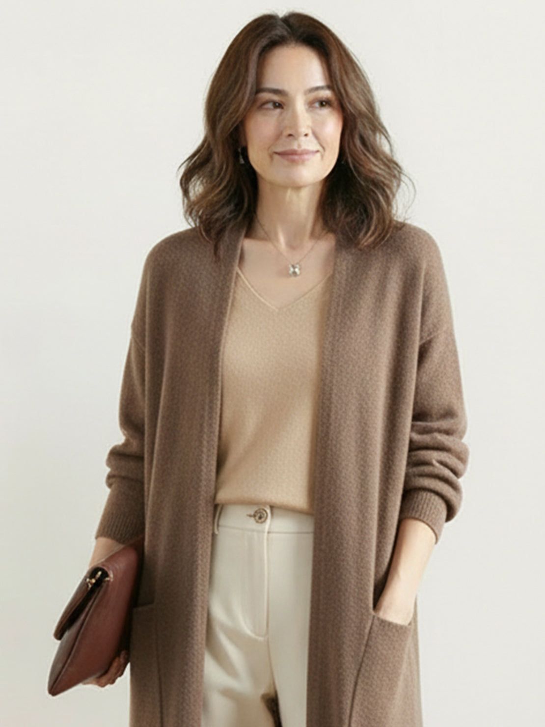 100% Australian Merino Wool longline open-front cardigan with front pockets and ribbed cuffs