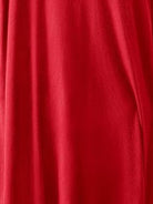 Woman wearing oversized long-line pullover and wide-leg pants loungewear set