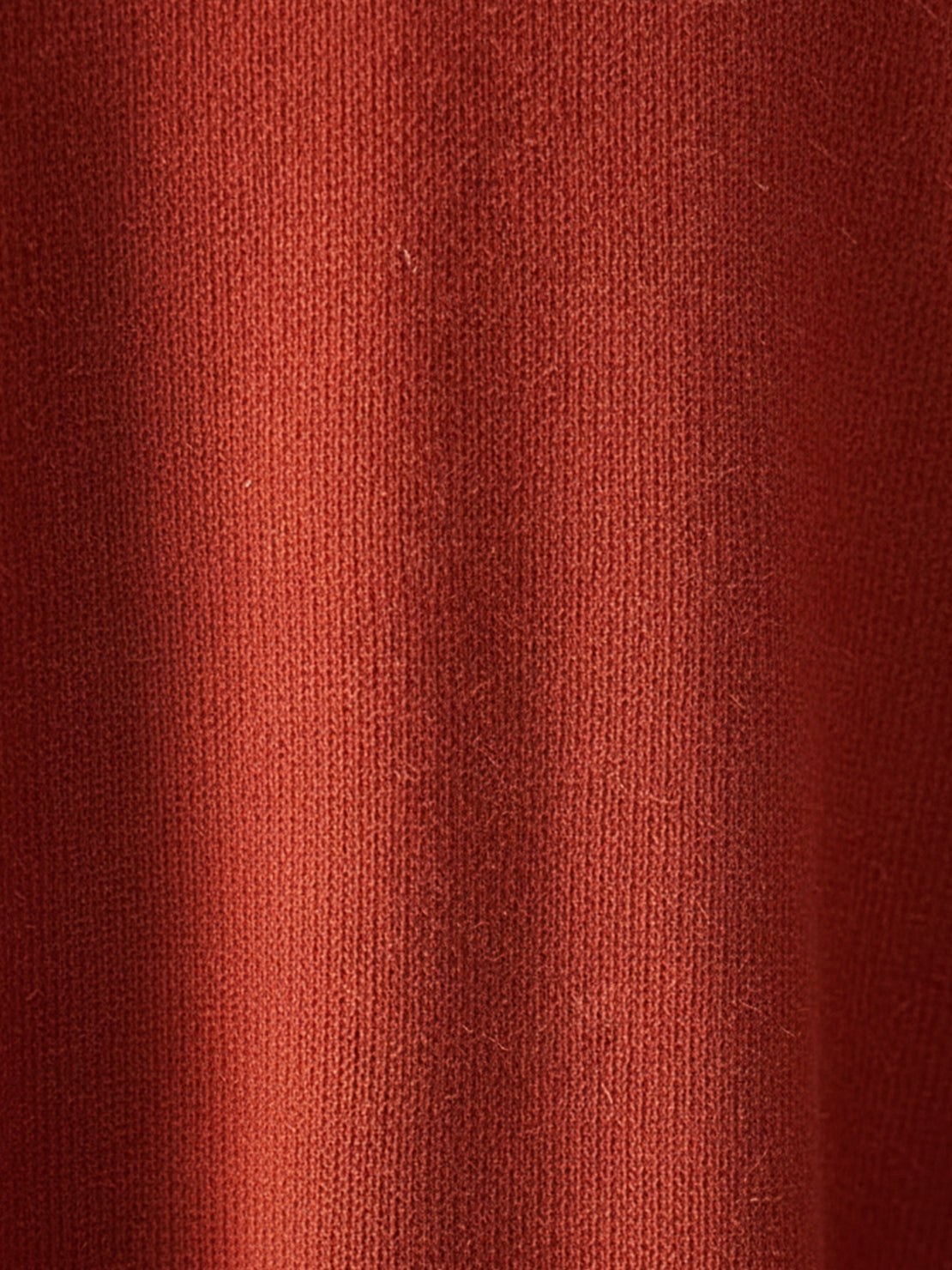 Woman wearing oversized long-line loungewear set with pullover and wide-leg pants