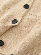 Wool-blend button-front cardigan with wide collar and five-button closure designed for lightweight warmth and layering.