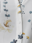 Floral button-down shirt with long roll-up sleeves and hip-length relaxed fit