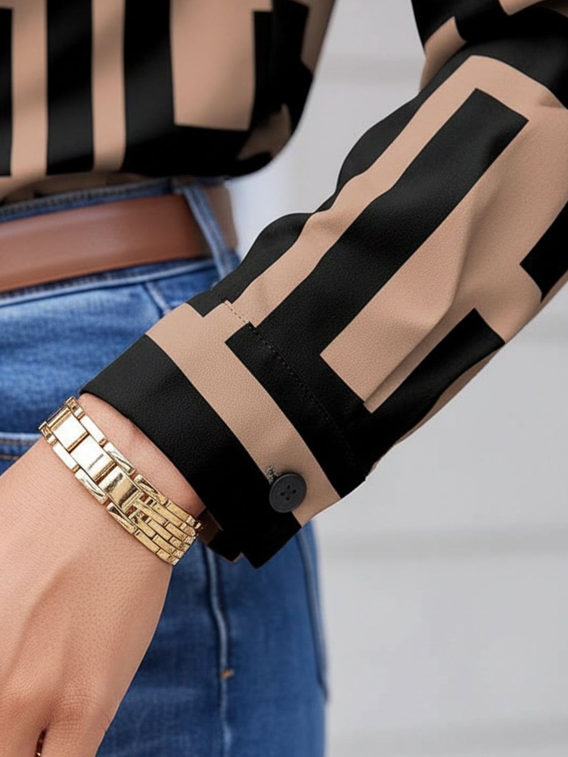 hip-length floral button-down shirt with rolled-up sleeves and relaxed fit