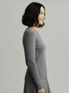 Lightweight 100% cashmere round neck pullover with long sleeves and hip-length cut for versatile styling