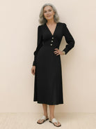 Women wearing slimming V-neck midi dress with button-front and ruffle cuffs