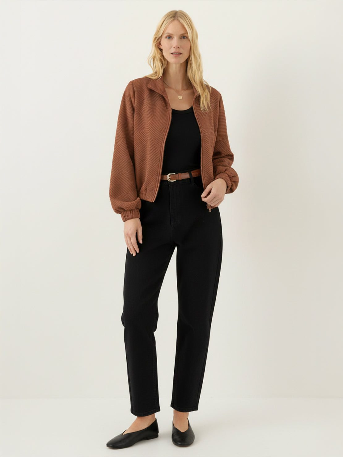 Cropped textured baseball jacket with full zipper and elastic cuffs, ideal for casual wear and layering