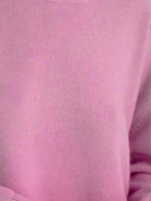 Oversized crew neck knit sweater with dropped shoulders and ribbed cuffs in neutral color