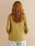 Cotton-linen blazer with relaxed fit, notch lapels, two-button closure, patch pockets, and natural textured fabric.