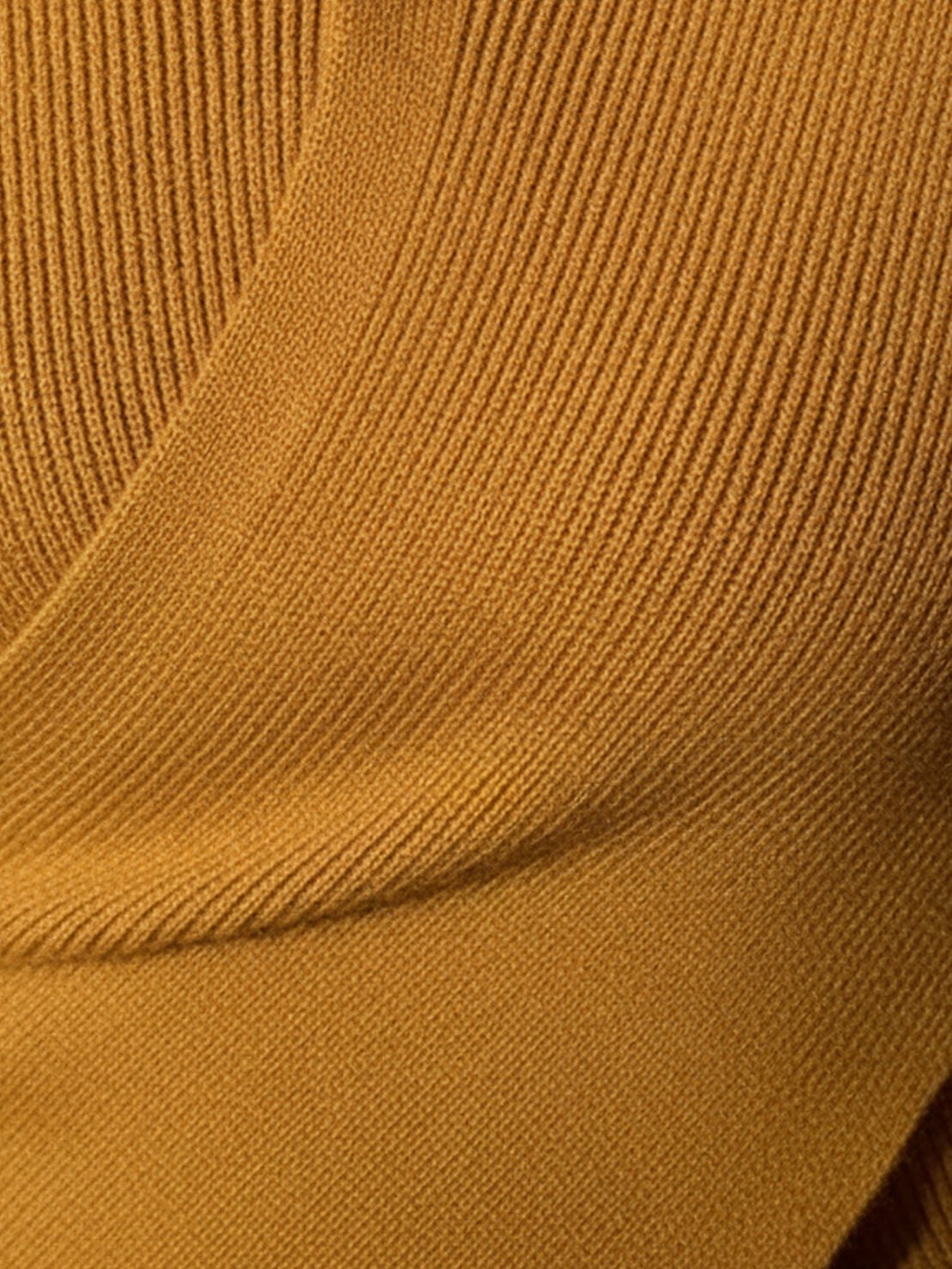 Slim fit asymmetric wrap ribbed knit top with diagonal button closure and flared cuffs