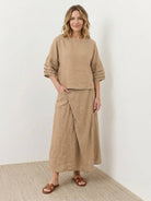 woman wearing 100% cotton wrap skirt two-piece set with crinkle texture and wrap-front maxi skirt
