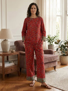 100% cotton Chinese Pankou pajamas with tunic top, wide-leg pants, frog closures, and bold landscape print