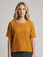 Floral Jacquard Pleated Top with 3D floral texture, flutter sleeves, and relaxed A-line fit