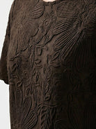 Floral jacquard pleated top with 3D floral texture, flutter sleeves, and relaxed A-line fit