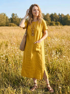 100% linen relaxed fit pocket midi dress with short sleeves and side slits