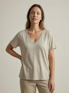 Woman wearing a breathable linen-bamboo V-neck tee with short sleeves and relaxed fit