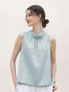 100% linen sleeveless cowl-collar top with boxy, slightly flared hem and natural texture