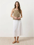 100% linen yarn-dyed vest with fitted silhouette, square neckline, button-front, curved hem, and welt pockets