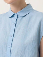 100% linen two-way button blouse with A-line silhouette, cap sleeves, and rounded Peter Pan collar