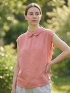 100% linen two-way button blouse with Peter Pan collar and cap sleeves on a model