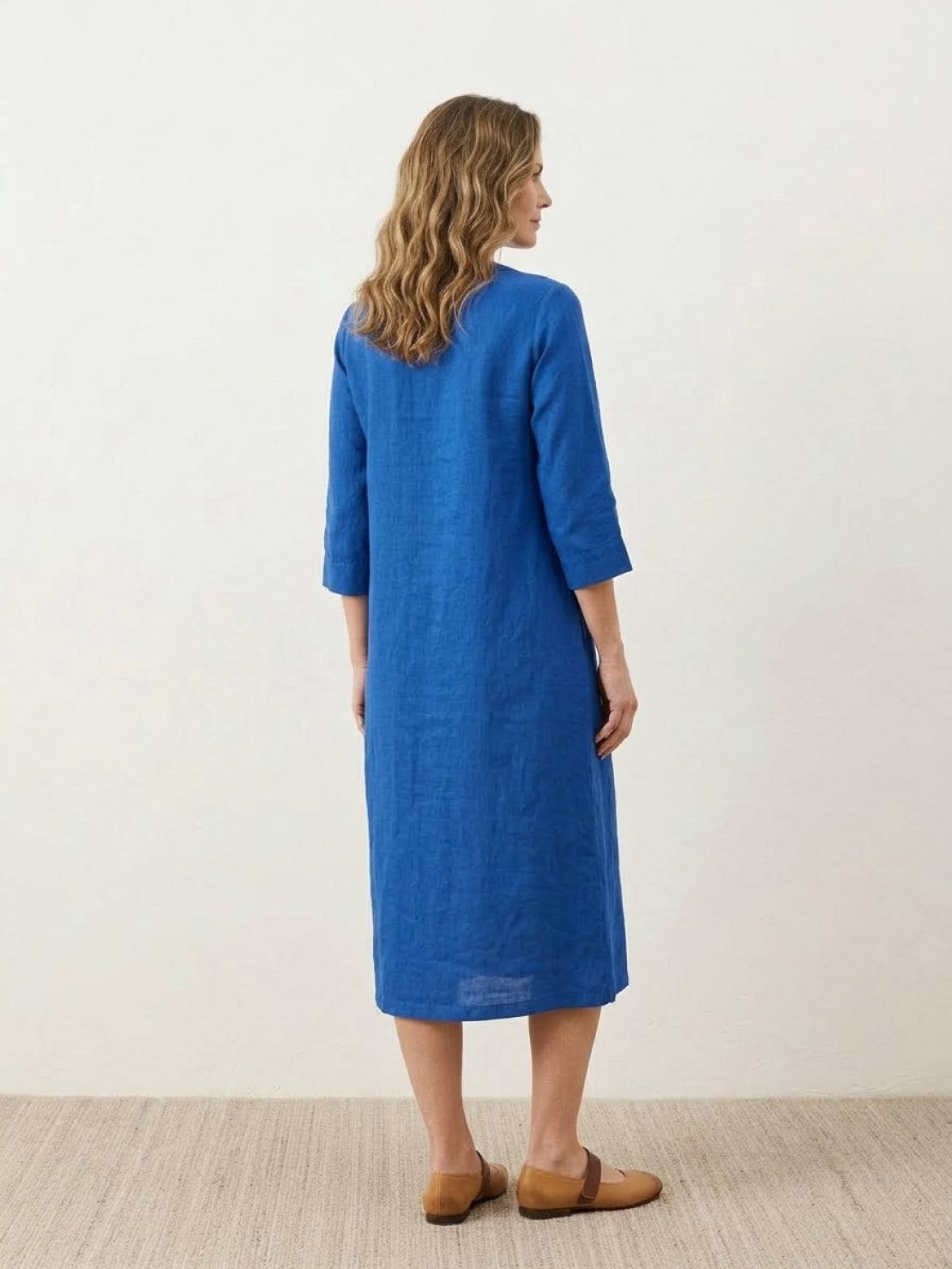 Relaxed A-line cotton linen dress with pintuck pleats, 3/4 sleeves, side slits, and breathable fabric