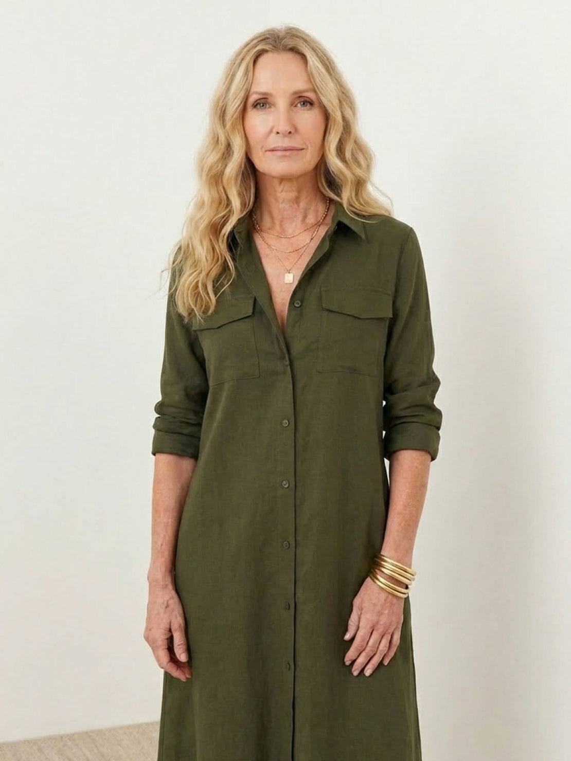 Maxi-length wrinkle-free dress with button-down front, point collar, chest pockets, long roll-up sleeves, and side slits for movement