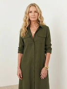 Maxi-length wrinkle-free dress with button-down front, point collar, chest pockets, long roll-up sleeves, and side slits for movement