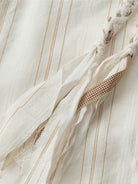 Linen-cotton striped shirt with braided tassel trim and relaxed fit