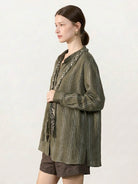 Linen-cotton striped shirt with tassel trim, relaxed fit, and braided collar detail