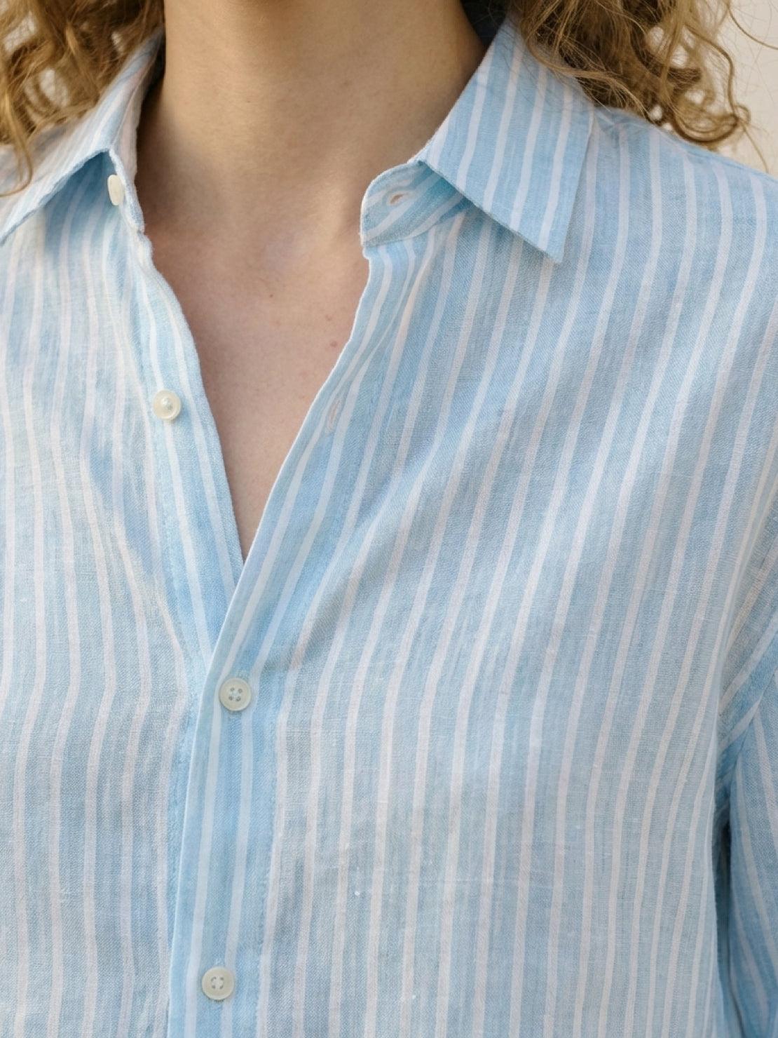 100% linen pinstripe shirt with loose fit, drop shoulders, and curved hem longer at back