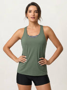 Three-piece tankini set with criss-cross back tank top, push-up sports bra, and printed boy shorts