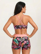 Three-piece tankini set with criss-cross back design including loose tank, printed sports bra, and boy shorts