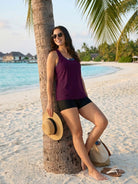 Three-piece criss-cross back tankini set with loose tank top, printed sports bra, and boy shorts