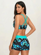 Three-piece tankini set with criss-cross back and printed sports bra and boy shorts